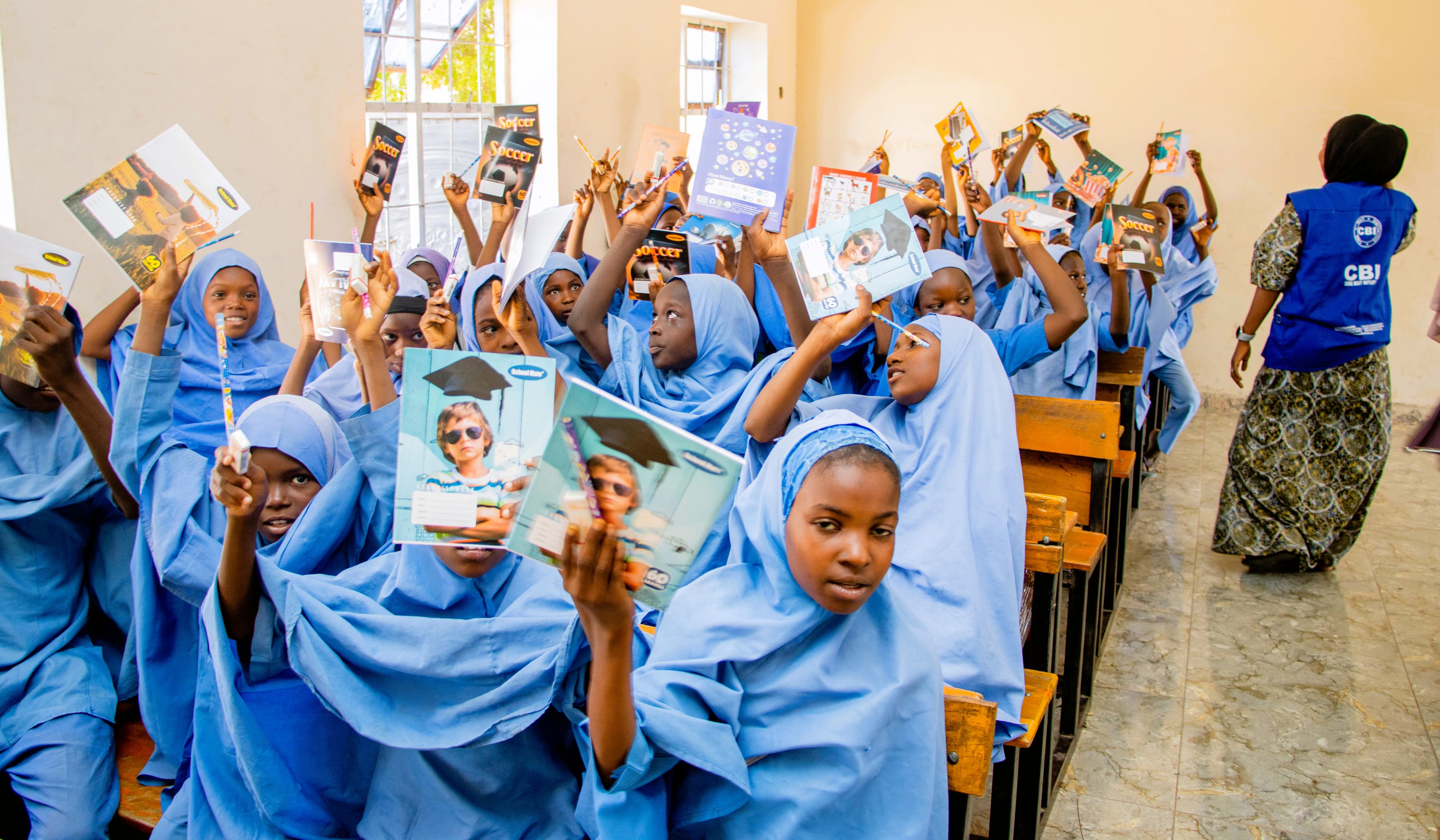 Children raising books with pride โ Borno State