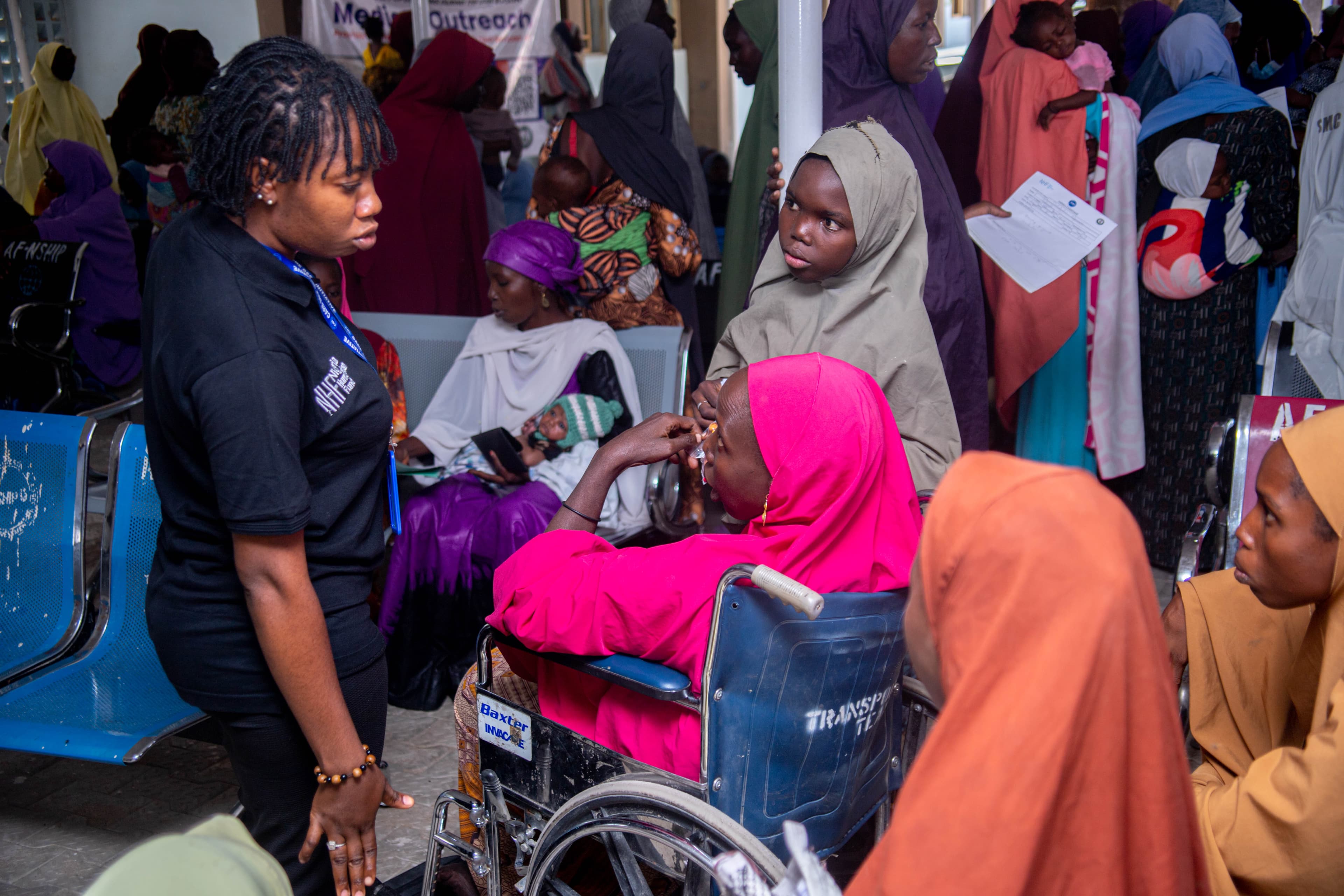 Woman on wheelchair receiving treatment โ CBI clinic